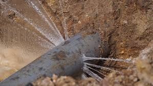 Buried municipal water service line fracture identified with underground pipe locating equipment